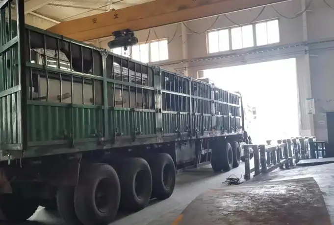 Horizontal filtration equipment loaded on a truck inside a workshop for dispatch
