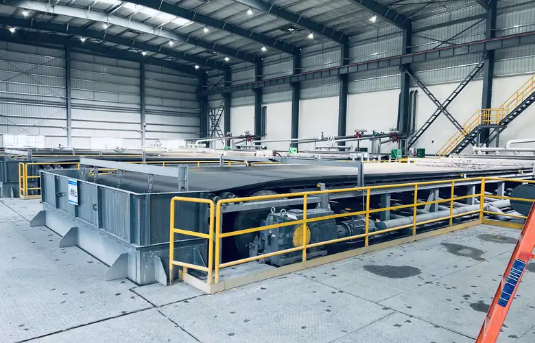 End view of a horizontal vacuum filter with access platform and safety railings
