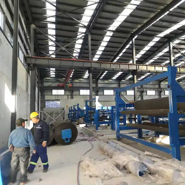 Site personnel beside a horizontal belt filter frame during installation