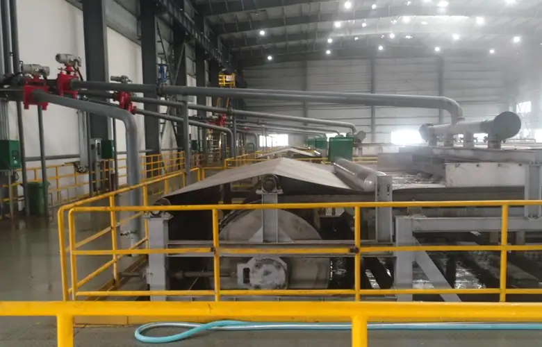 Side view of belt filtration equipment and feed piping at Wengfu