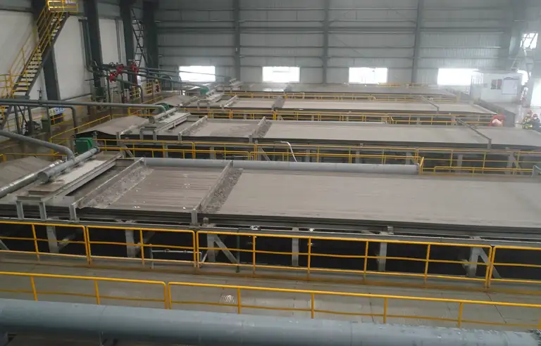 Wengfu filtration hall with operating personnel beside the equipment